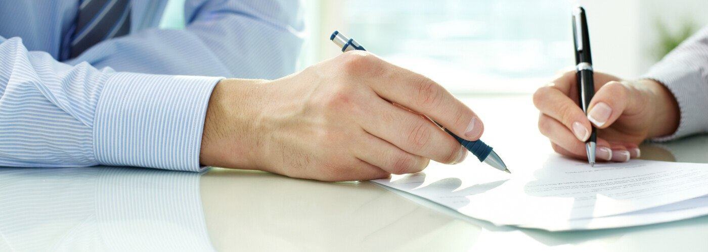 Man and Woman Signing Contract